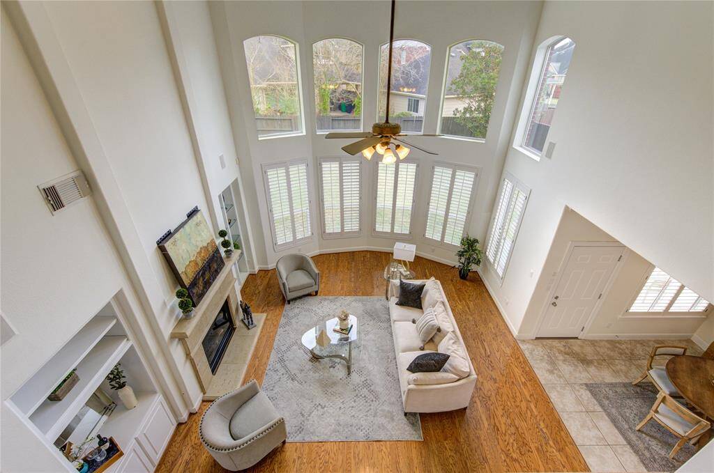 From the upstairs landing, enjoy a panoramic view of the entire living area, highlighting the home’s open and airy design—perfect for both everyday living and entertaining!