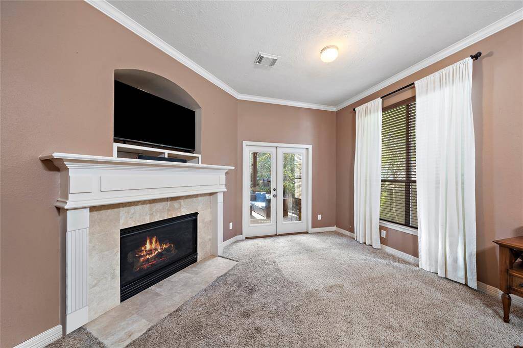 Perfect for relaxation, the primary bedroom is a luxurious retreat with a spacious layout offering direct access to the backyard oasis.