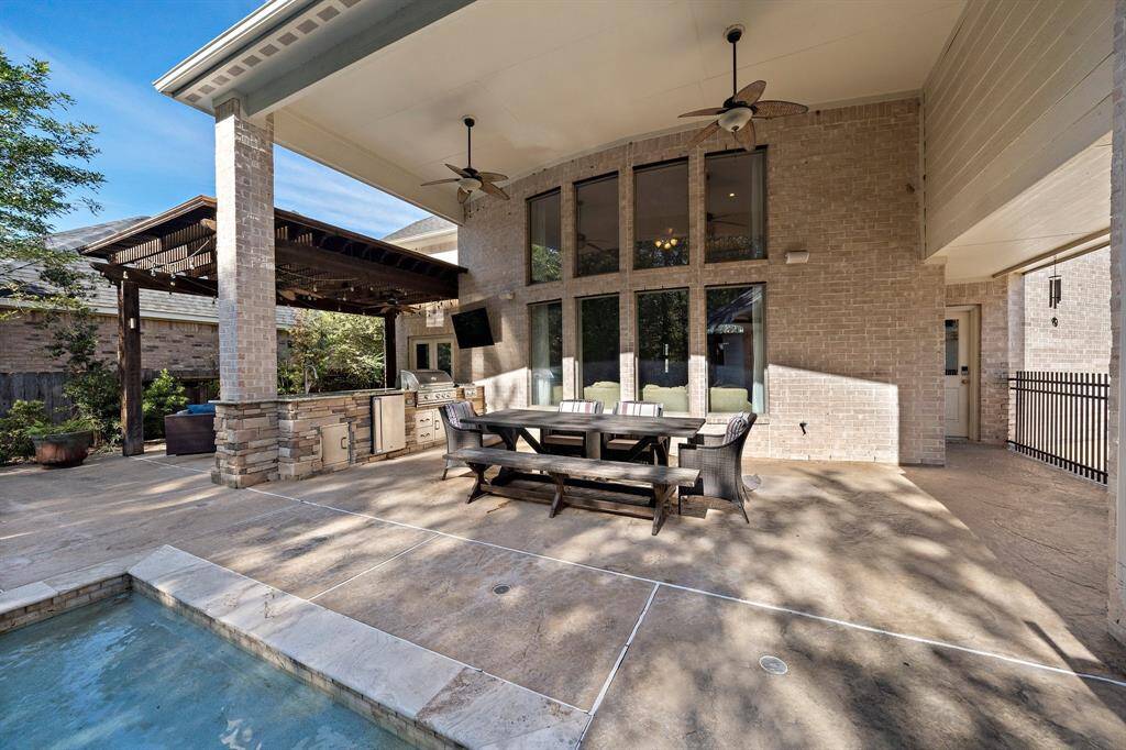 Generously sized, the backyard highlights pleanty of seating accommodations—perfect for relaxation and entertainment.