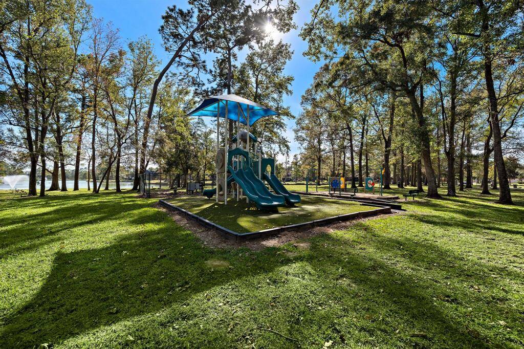 Take in the lush surroundings of the community playground with shaded play structures and plenty of space for outdoor activities.