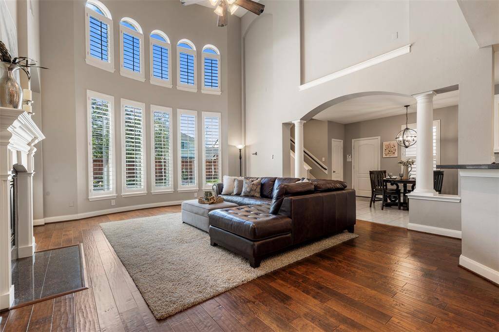 Two story living space with tons of natural light.  Behind the living room is the second set of stairs.