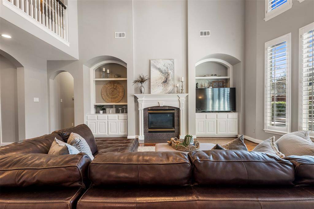 Built ins on both sides of the gas log fireplace and surround sound throughout the home.