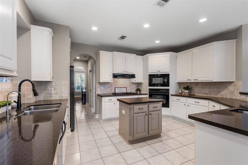 Huge kitchen with tons of cabinet and counter space.  Double basin sink is located on the left.