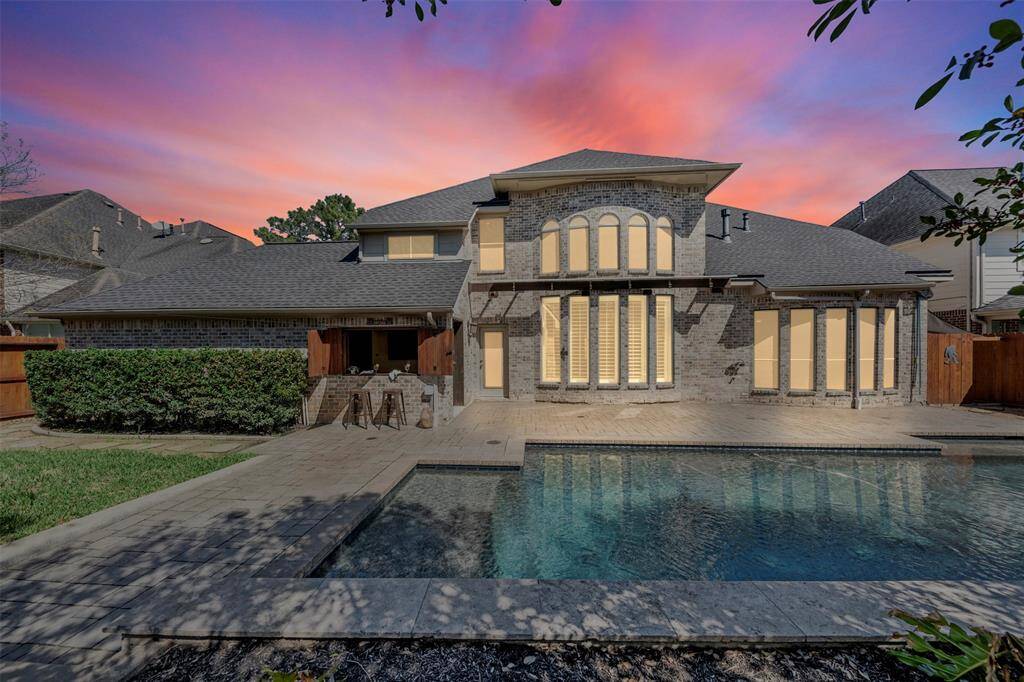 Gorgeous backyard with custom pool/spa, and a Tiki Bar.