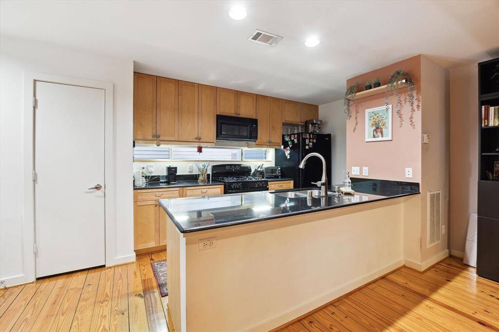 Additional view of the kitchen.