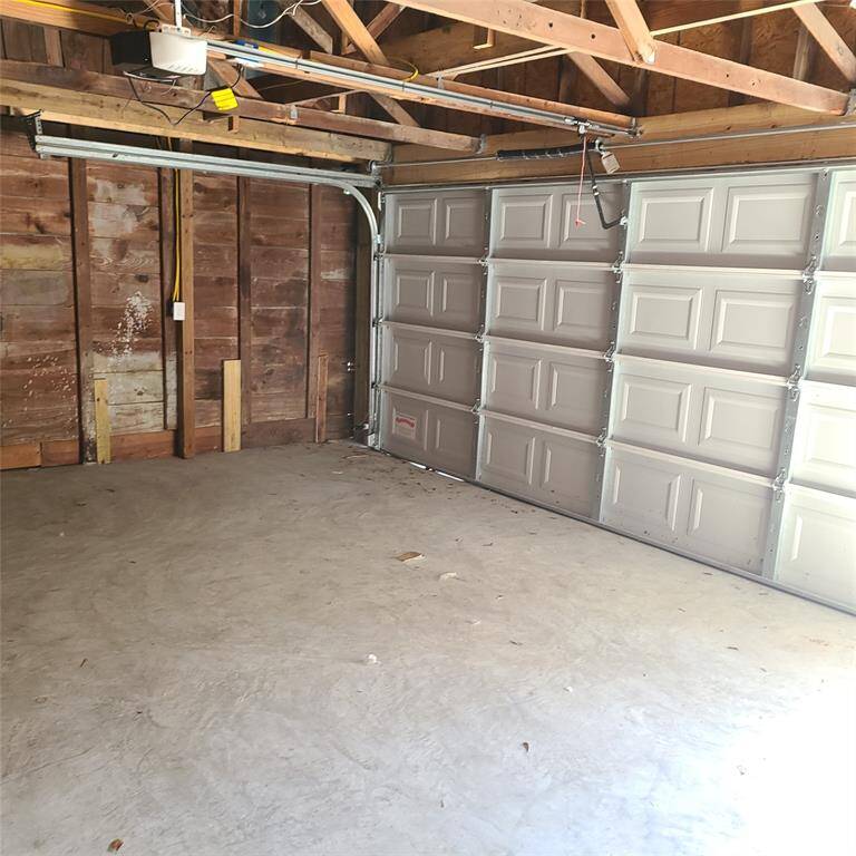 showing inside garage. Remote-controlled garage door