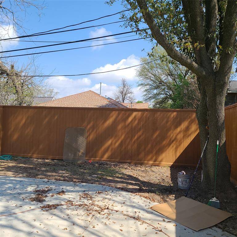 back curve of driveway, showing brand new, custom fence