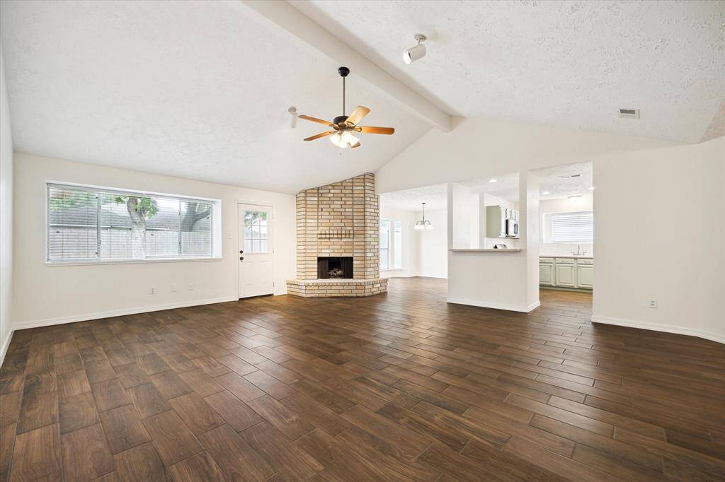 This home has been beautifully updated from top to bottom with wood-look tile flooring. The Main living area is open to both the Kitchen and dining areas.