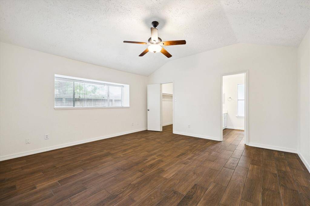 Primary bedroom is generously sized with a walk in closet to the left and ensuite to the right.