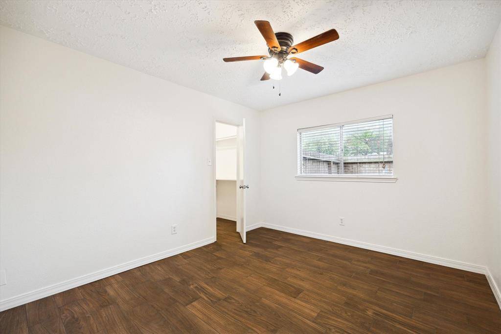 This roomy secondary bedroom is ready for family and guests.