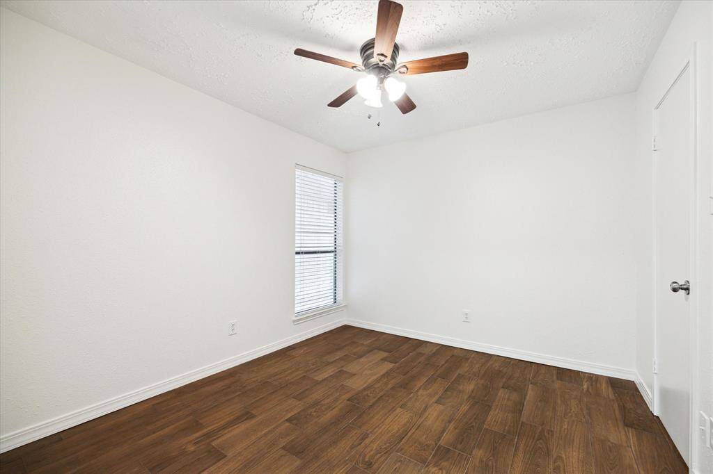 Your family and friends will rest comfortably in either of the spacious guest rooms. Just like the other secondary bedroom, this room has gorgeous wood-look tile flooring, fresh neutral paint and easy access to the full hall bathroom.