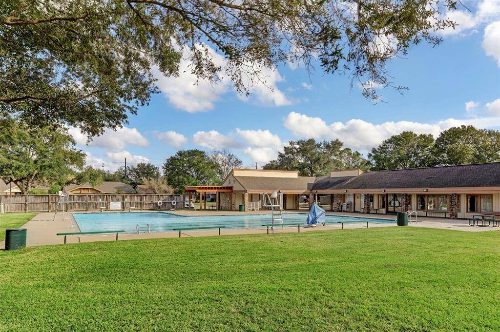As summer approaches, this pool will soon be alive with the laughter and splashes of neighborhood children. Just down the street, the park, playground, and tennis courts await, promising endless hours of outdoor fun.