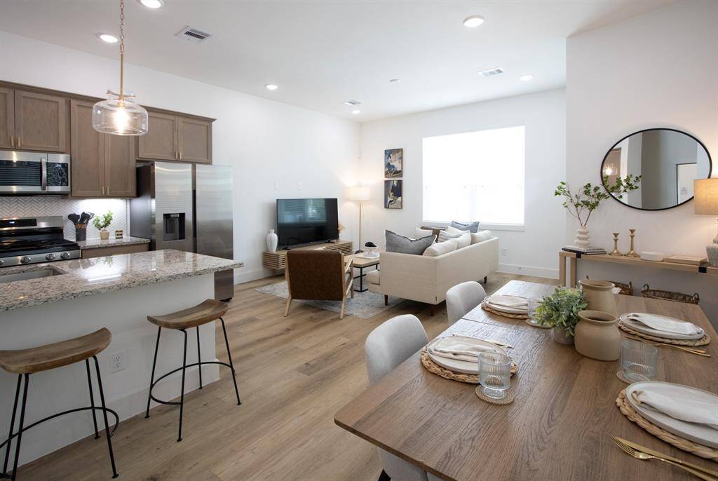 Model Home w/ granite counter top. 1544 has upgraded quartz counters!