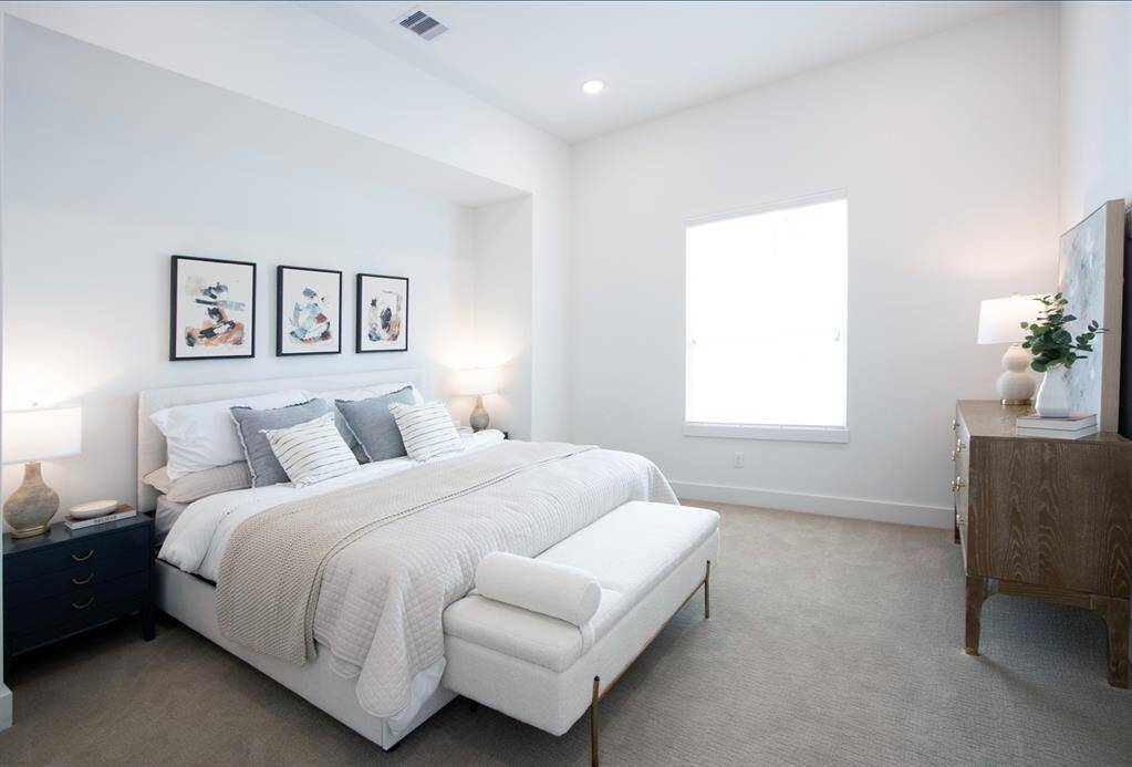 Beautiful primary bedroom with 2 walk in closets!