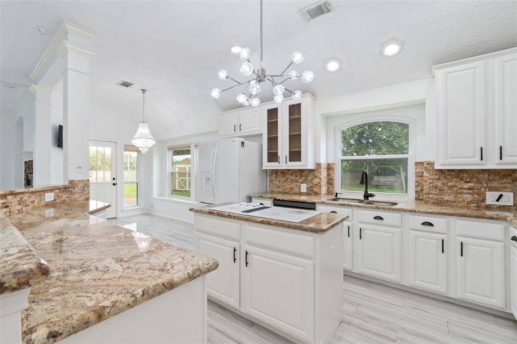 Open kitchen with new granite countertops