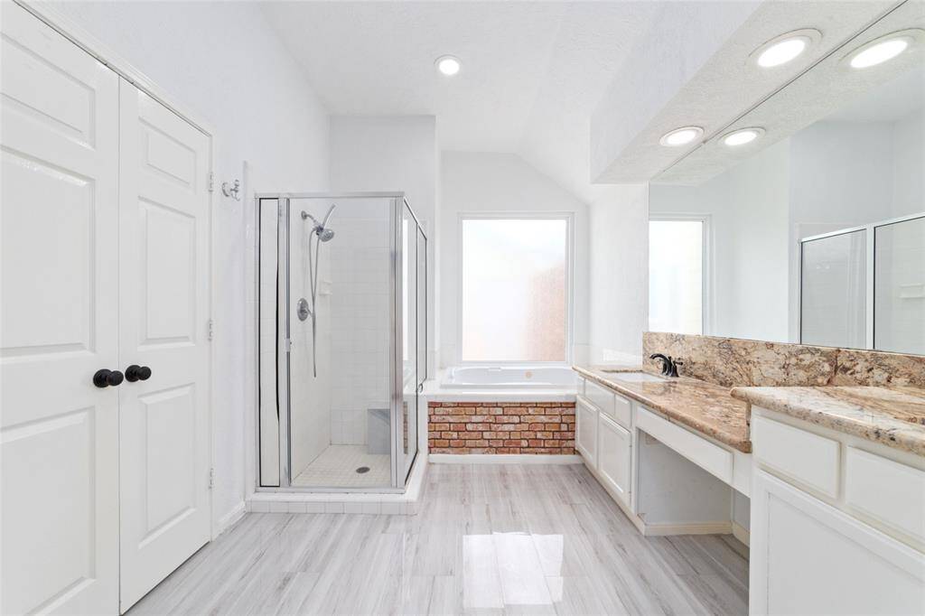 Primary bathroom with separate tub and shower