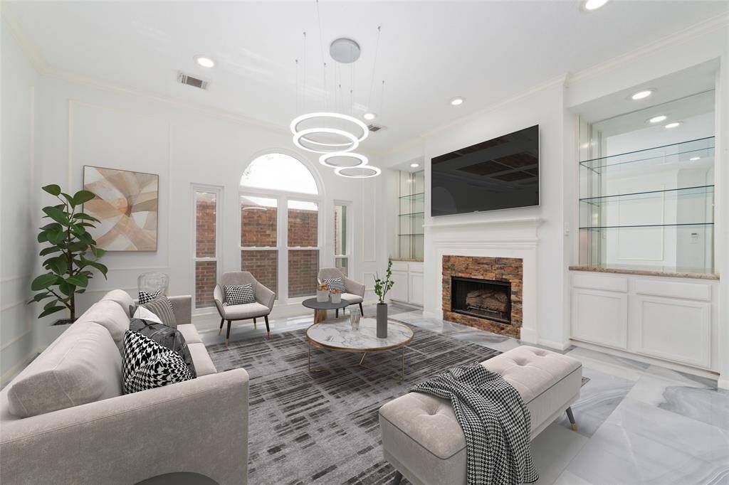 Secondary living room with cozy fireplace. VIRTUAL STAGING