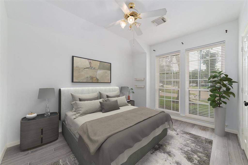 Front secondary bedroom. VIRTUAL STAGING