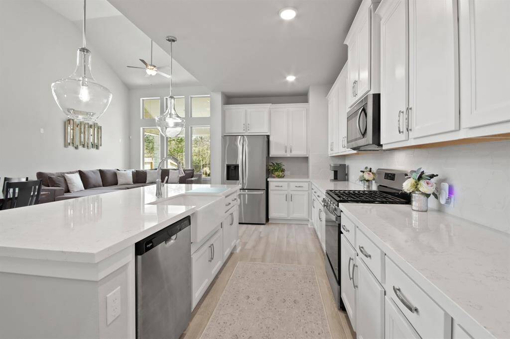 Beautiful kitchen is large in size with beautiful cabinets and stainless-steel appliances.