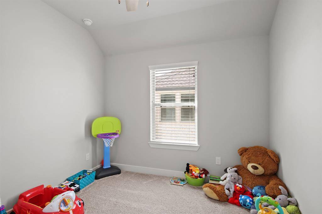 This bedroom operates as a bedroom or playroom.