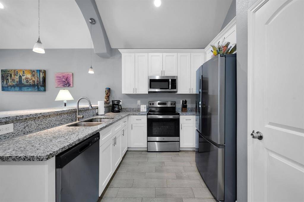 Kitchen with great/gently used appliances with a cute breakfast bar!
