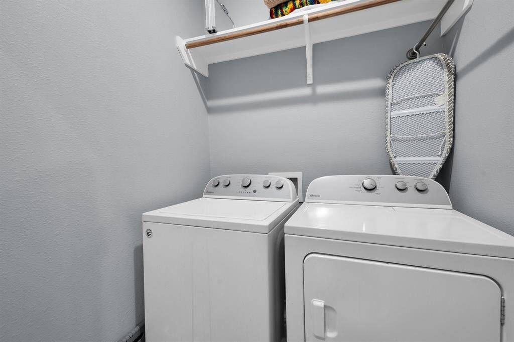 Spacious laundry room with shelving