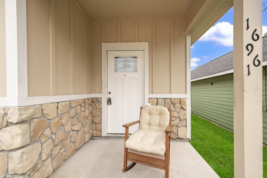 The cutest porch to sit and look out onto the street.