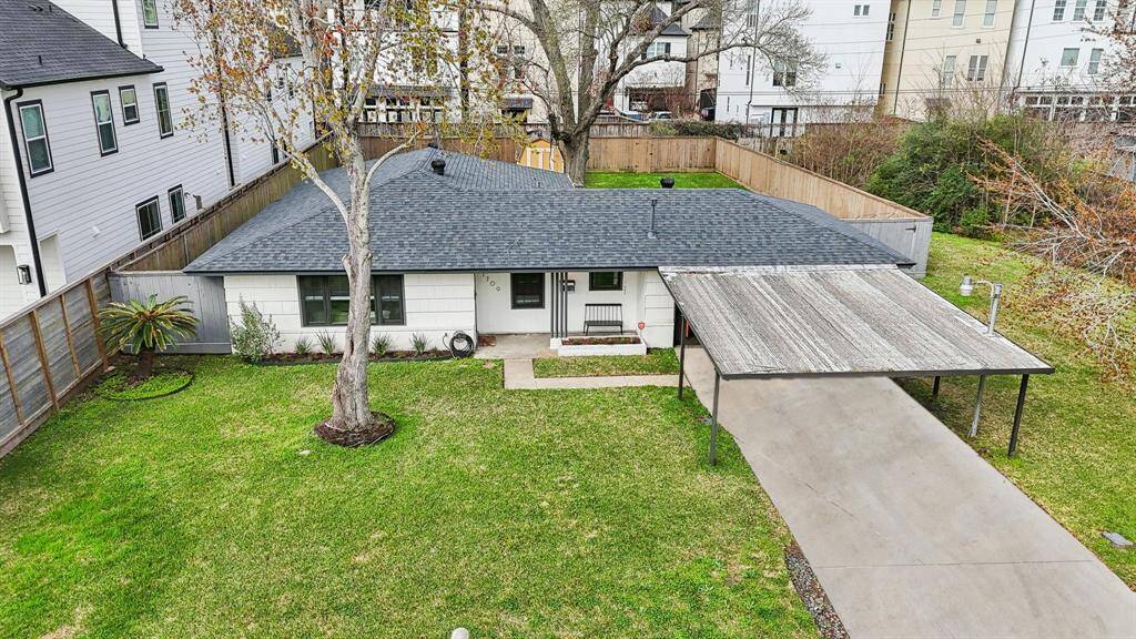 Spacious driveway with carport.