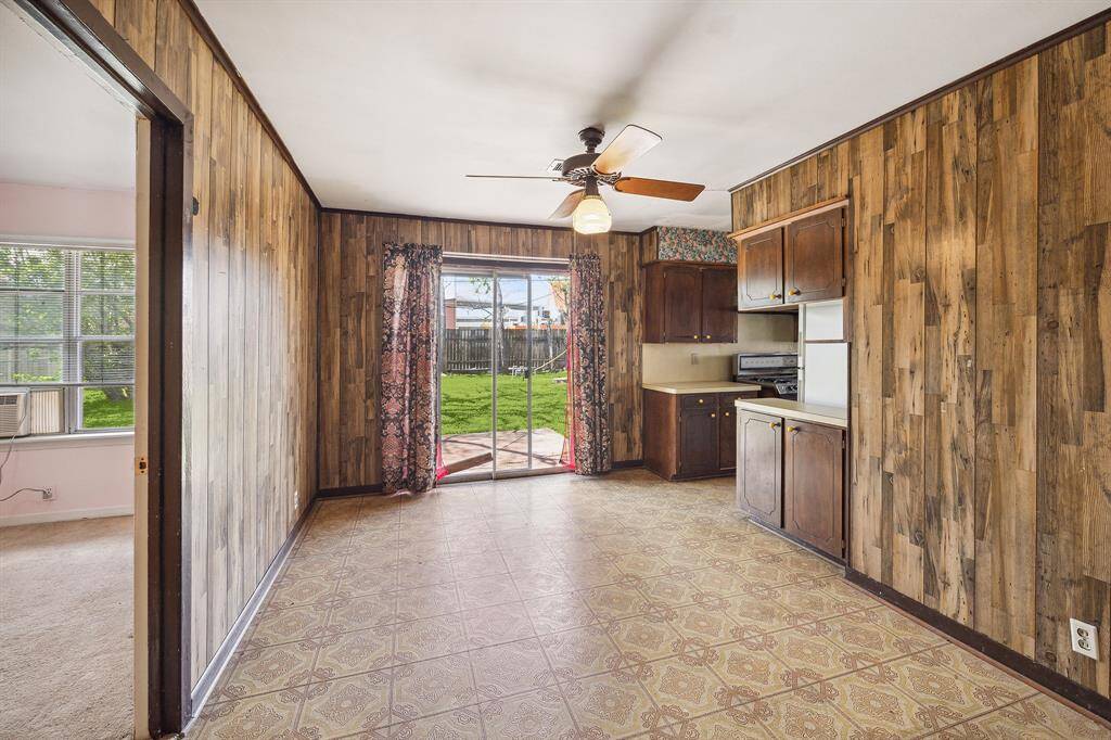 The living room leads to the dining room and kitchen.