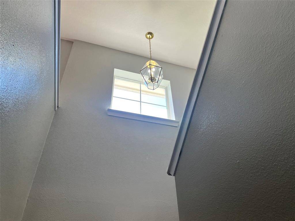 HIGH CEILING STAIRS BRINGING NICE LIGHTING