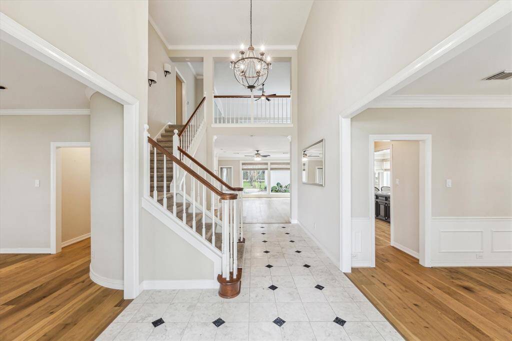 This is the view when entering. The entry area features an accented tile floor and leads to the formal dining room at the right, the home office/study at the left and continues to the family room located at the rear of the home.