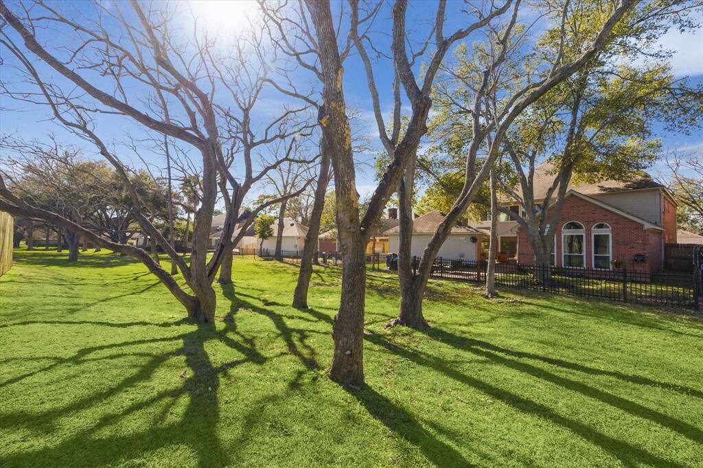 A view from the back greenspace toward the rear of the home.