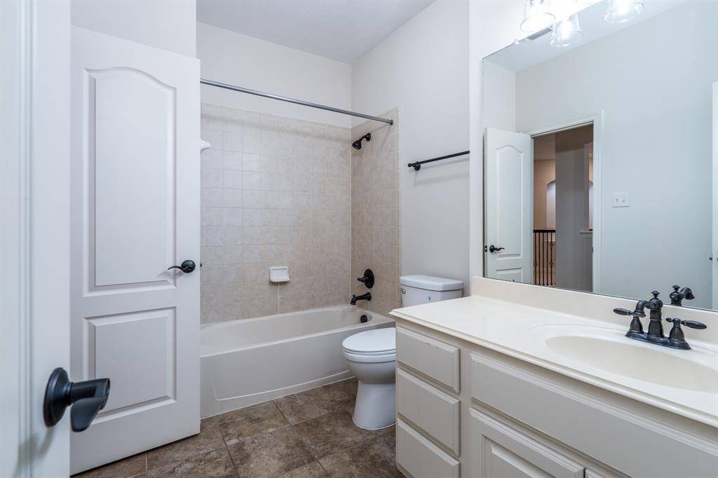 One of the three full bathrooms located upstairs.