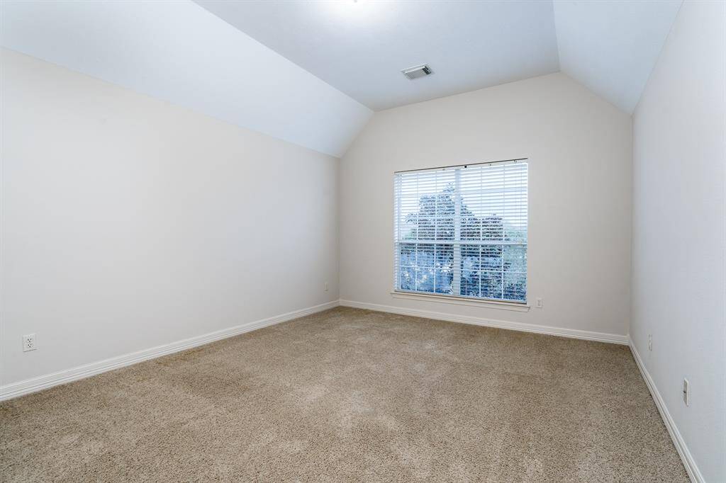 One of four secondary bedrooms located on the second floor.