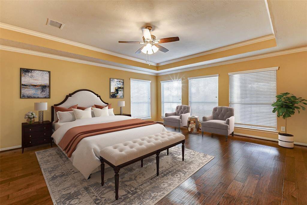 The expansive 15x21 primary bedroom boasts a stunning wall of windows that provides a picturesque view of the resort-style backyard, creating a tranquil retreat filled with natural light.*virtually stagedThe expansive 15x21 primary bedroom boasts a stunning wall of windows that provide a picturesque view of the resort-style backyard, creating a tranquil retreat filled with natural light