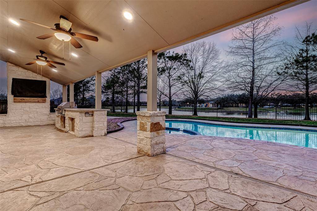 Enjoy time with friends and family on this spacious, 17x9 custom patio complete with mounted tv and built-in grill.