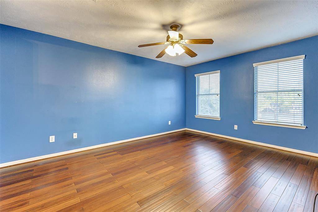 Secondary bedroom 3 offers a lighting ceiling fan, decorative paint color, and oversized closet.