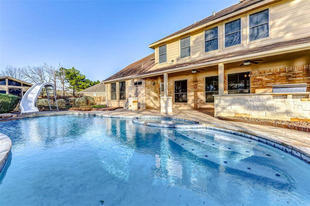 The best pool weather is right around the corner! With a slide, heated pool and spa, and expansive covered back patio with ceiling fans, your own private resort is right in your own backyard.