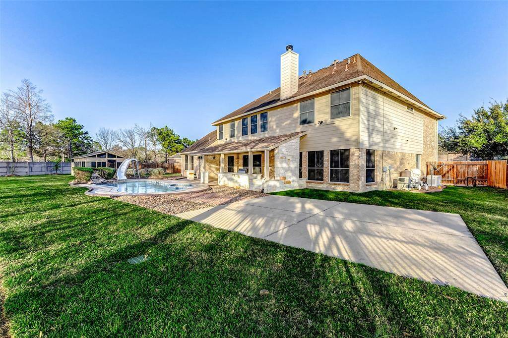 Tons of opportunity for fun and convenience in this spacious yard. The concrete can provide a place for a sport court.