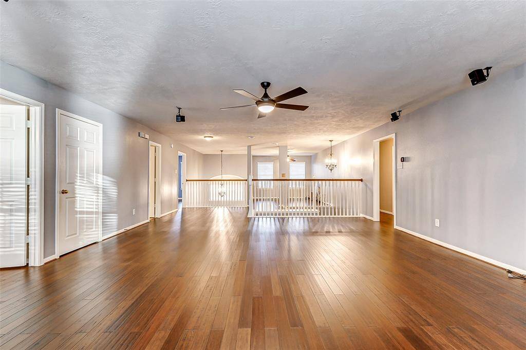 Upstairs, a spacious game room/media room with built-in speakers offers endless possibilities—perfect for a pool table, theater seating, toys, and more!