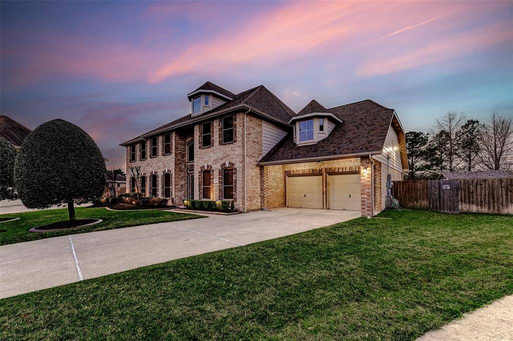 At night, the exterior comes to life with stunning landscape lighting, creating a beautifully illuminated ambiance.