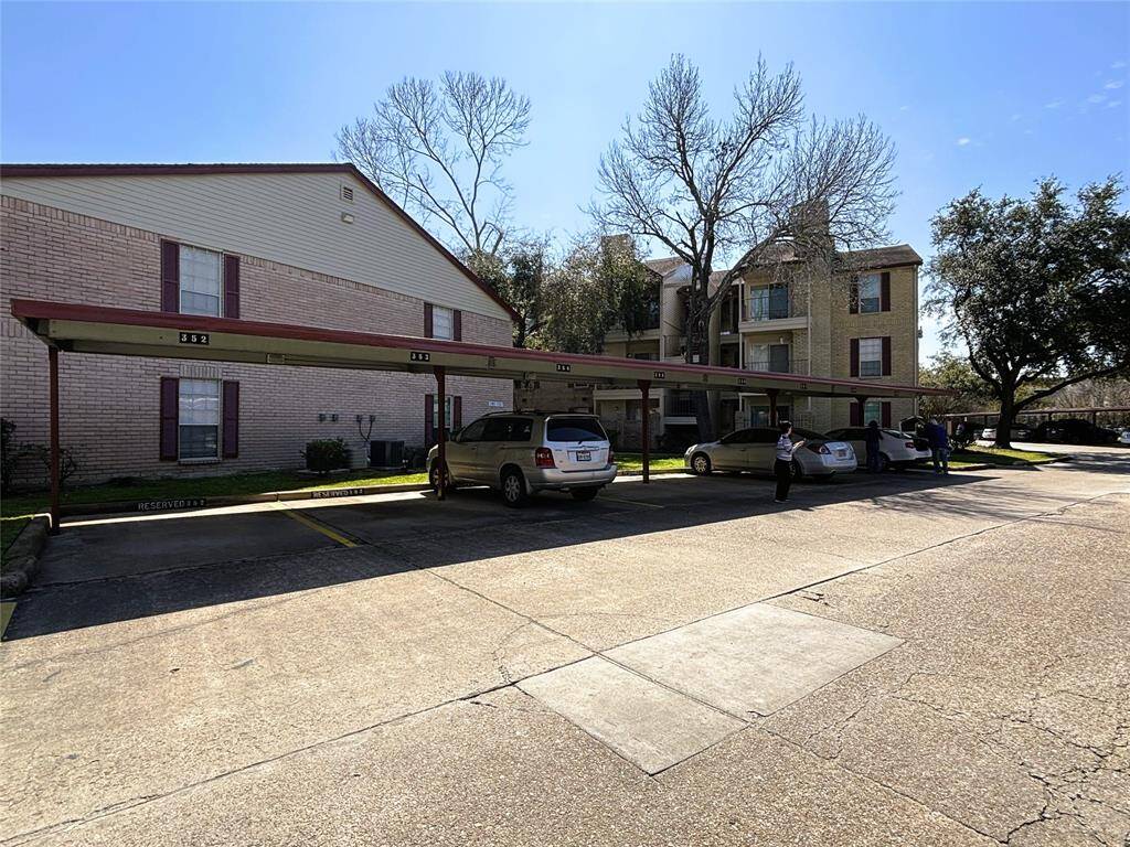 Assigned covered parking near the unit.