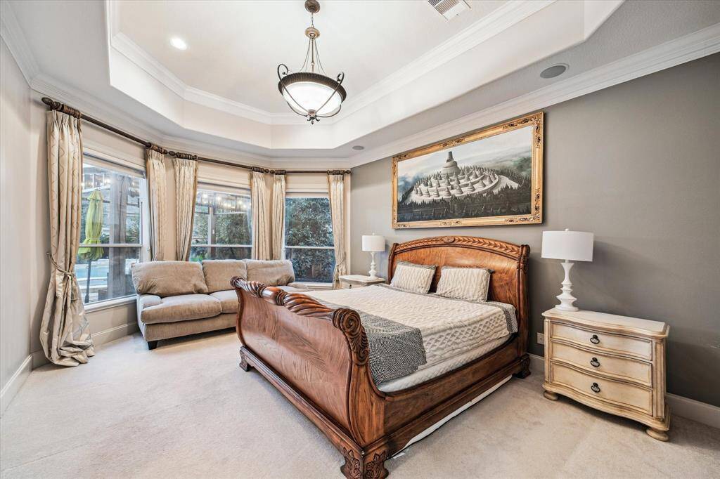 Bay windows in the primary suite bring the outdoors in and invite tons of natural light.