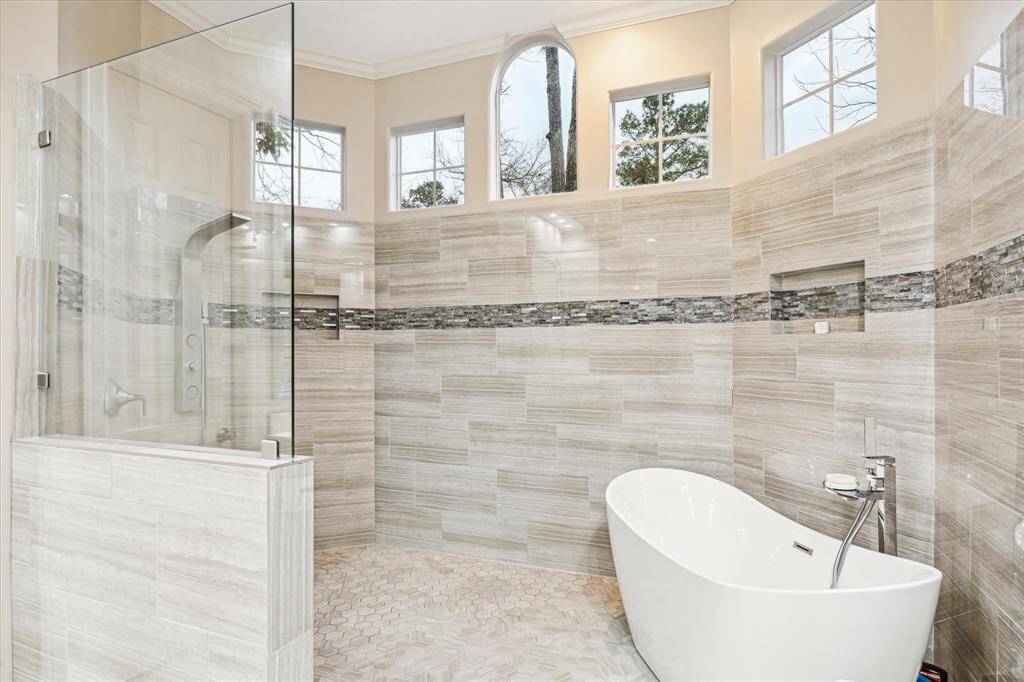 The oversized walk-in shower shape with soaking tub is the perfect escape to melt away the day’s troubles.