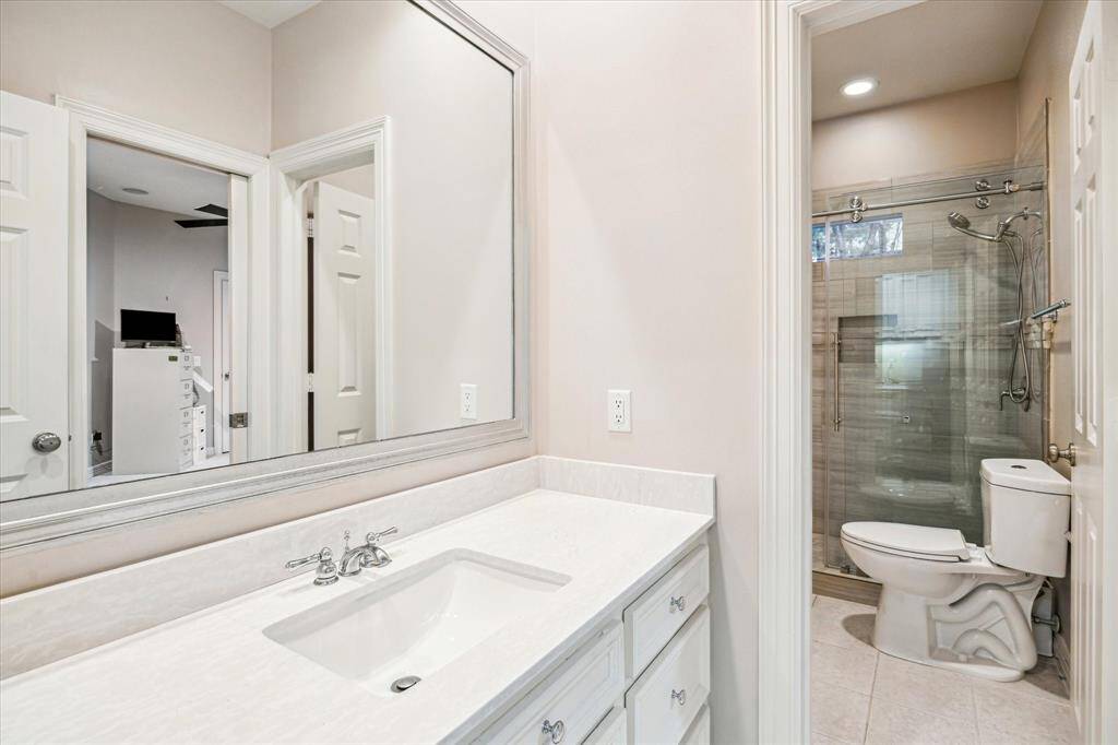 Even the guest bathroom boasts high-end finishes and a fabulous shower.