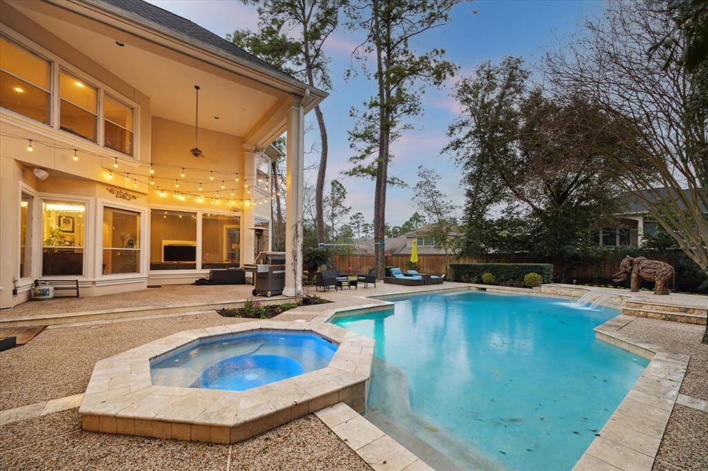 This backyard pool oasis is the true envy of the neighborhood and the favorite entertainment zone!