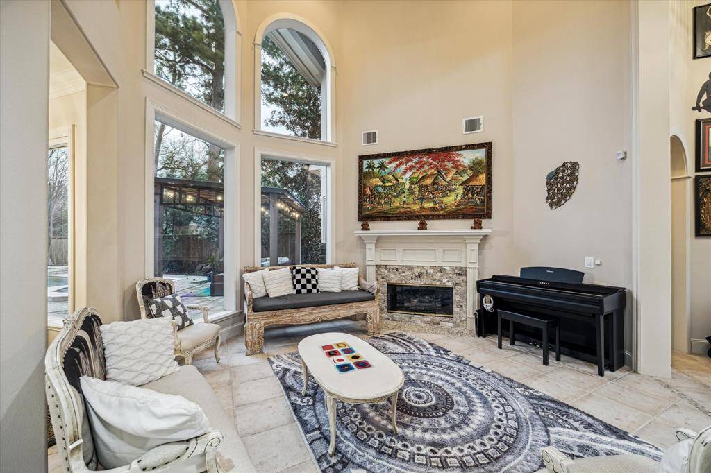From the foyer through the living room to the gourmet kitchen, tall reaching arches seamlessly create flow between the spaces.