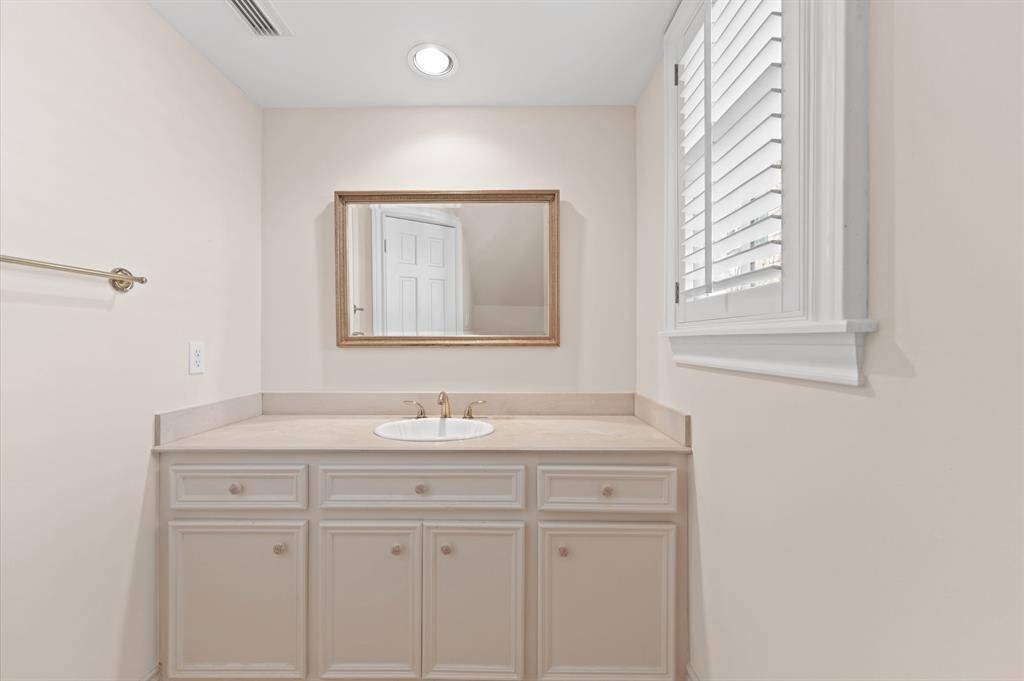 Half bath located under the staircase on first floor