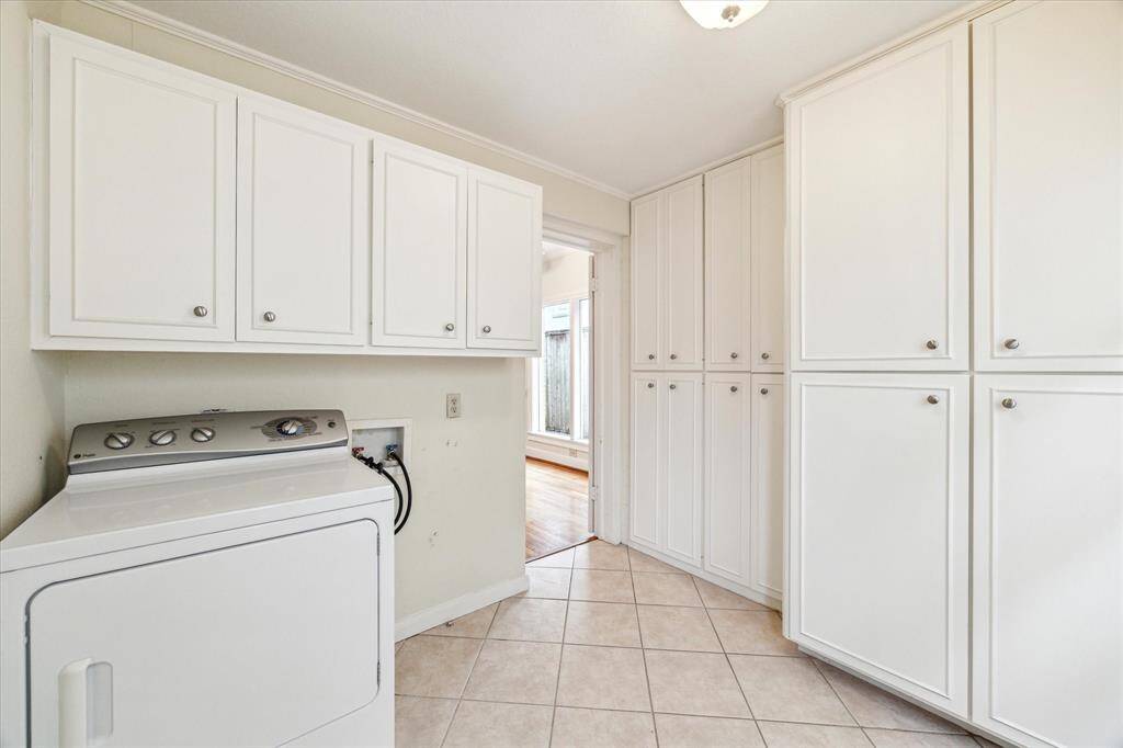 Utility room off the kitchen, leads to the large 2 car garage.