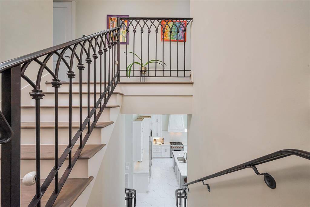 wrought iron spindles and wood floors stairs and upstairs